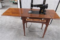 11- SINGER SEWING MACHINE IN CABINET