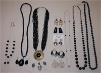 Assorted black necklaces, earrings