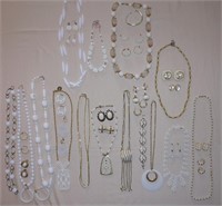 Assorted white necklaces, earrings, bracelets