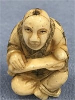 2" colored scrimmed ivory netsuke, of an oriental