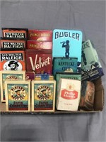 Assorted tobacco tins, cigarette papers