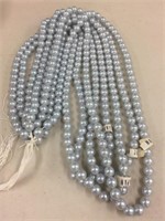 Plastic pearls light blue 16 strands