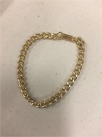 Box full of gold chain bracelets