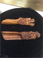 Carved wooden spice scoops with dragon heads