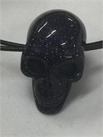 Stone skull pendant on cord