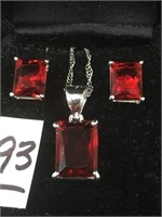 Ruby Emerald cut earrings and pendant on silver