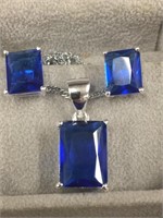 Sapphire cut crystals in emerald shape on silver