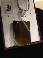 Banded agate pendant on silver chain