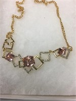 Pink quartz crystal necklace on a gold chain