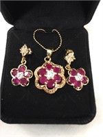 Ruby pendant and earrings on gold chain