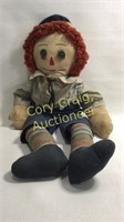 Early fabric Raggedy Andy doll with button eyes.