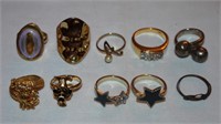 10 rings - variety of gold and silver tone, some