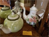 2 TEAPOTS -- 1 GREEN / CREAM AND 1 WITH ROSES