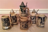 9 Unmatched pottery stein - 4 with relief, hand