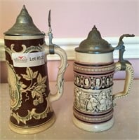 2 Unmatched pottery stein - relief,