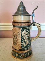 Pottery stein, marked Germany, #634, relief, hand