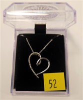 Sterling silver heart shaped pendant with diamond