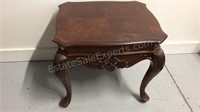 Queen Ann style wooden end table with claw foot