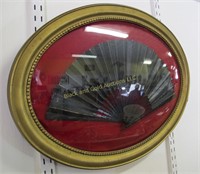 Oval framed vintage black fan