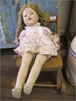 Oak doll rocker with antique doll