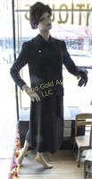 Female mannequin in black dress