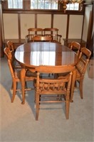 Wooden dining room table with 8 chairs