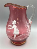 Large Mary Gregory cranberry pitcher