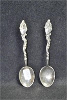 PAIR OF SPOONS WITH LADY HANDLES BOTH ARE MARKED:
