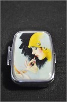 ART DECO STYLE PILL BOX - LADY IN YELLOW HAT ON