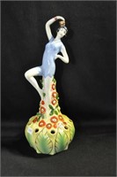 SWIMMER IN BLUE ATOP FLORAL PERCH - 9" MARKED: