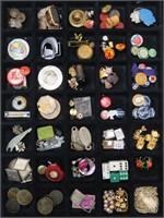 Showcase Full of Pins, Tokens, Jewelry and More