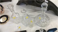 Three decanters and small vase