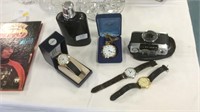 Hip flask, camera, pocket watch and three watches