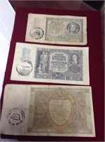 Twelve occupation banknoteswith Nazi stamps.