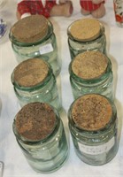 Six recycled glass storage jars