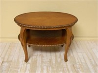 Applique Trimmed Oak Tiered Occasional Table.