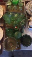 Set of green glasses and dishes