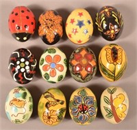 12 Breininger Redware Pottery Eggs.