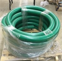 Pallet with new roll of green pump hose