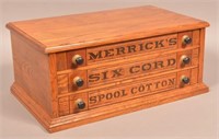 Merrick's Six Cord Spool Cotton Oak Cabinet.