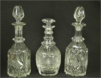 LOT OF THREE CUT CRYSTAL DECANTERS