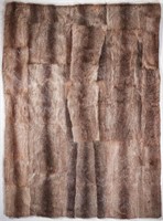 A QUEEN-SIZE SATIN LINED NUTRIA FUR THROW