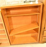 Four section wooden bookcase (48” x 36” x 13”D)