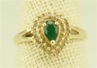 Marked 14kt ring with emerald stone