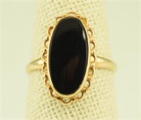 Marked 10kt gold and onyx ring
