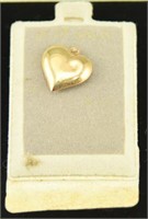 Marked 14kt yellow gold heart pendant