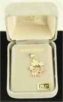 Marked 14kt gold “Mom” charm
