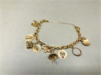 gold charm bracelet with gold charms