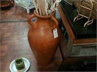 Brown vase with decor sticks