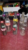 6 Coke bottles